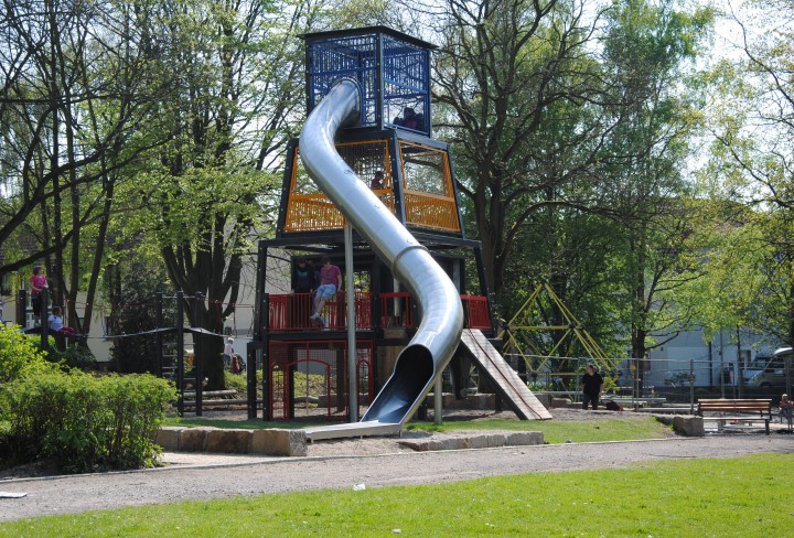 View of the playground: tower with slide and climbing elements