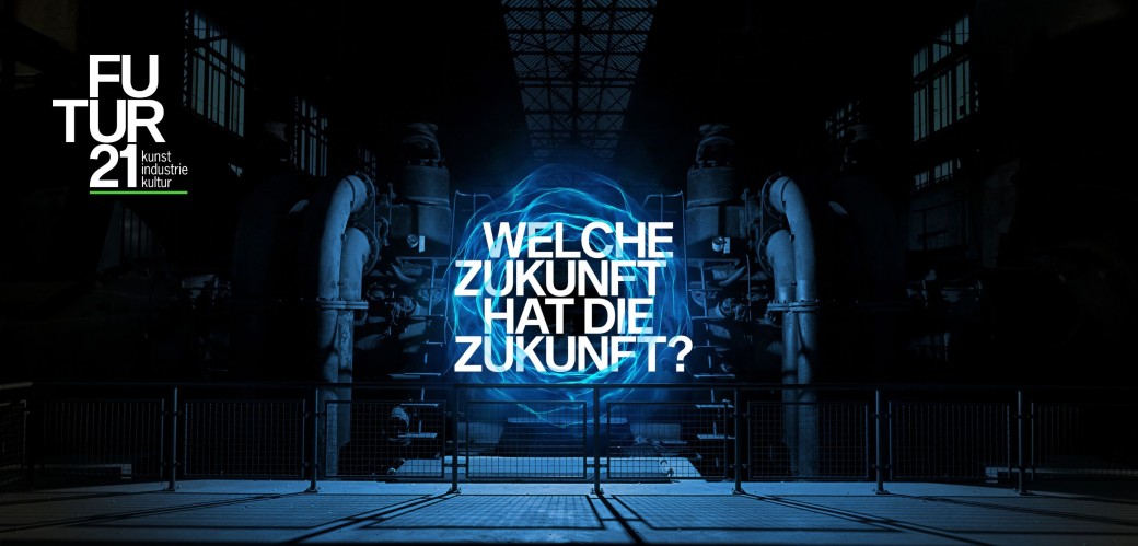 Luminous time tunnel, which opens in the middle of a dark factory hall and bears the heading : "What is the future?".