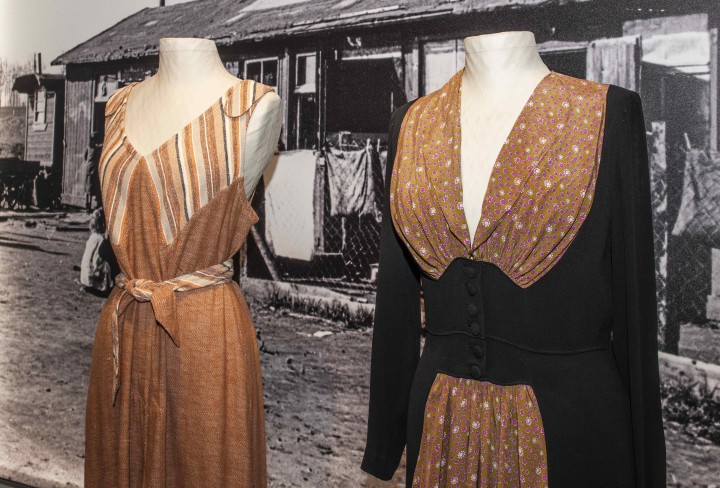 Two dresses on display in shades of brown