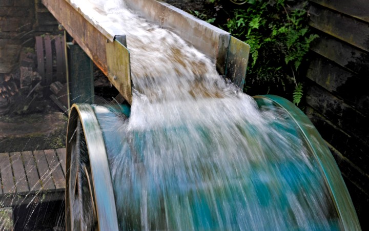 Detail view of running water on a mill wheel