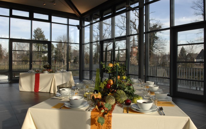 Set tables in a large room with huge windows