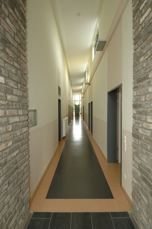 Glance into the hallway to the rooms