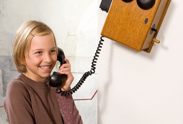 Girl with historical telephone