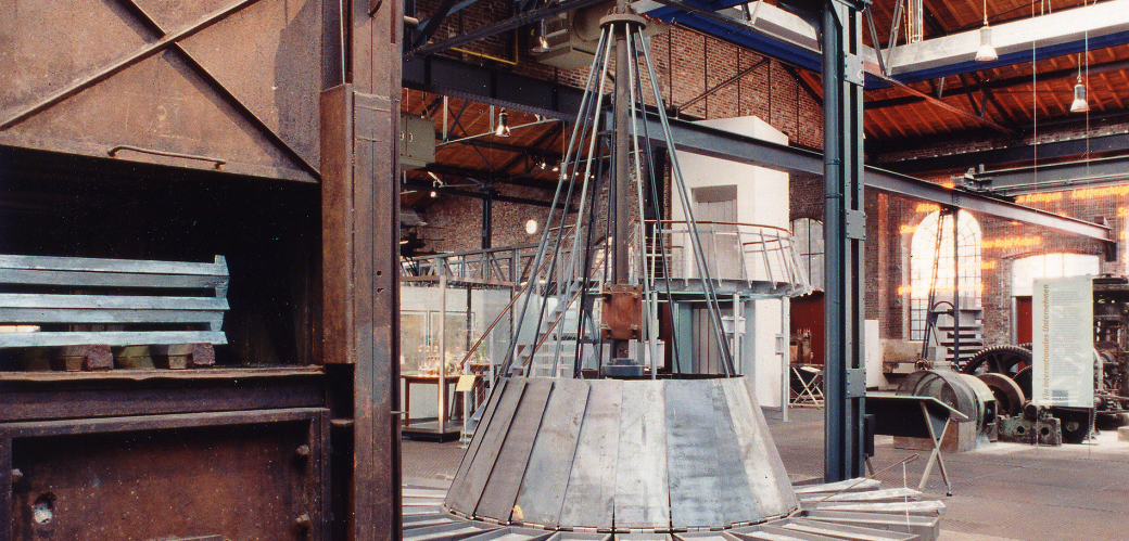 View into the rolling hall with melting furnace and casting carousel